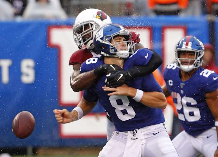 Oct 20, 2019; East Rutherford, NJ, USA; New York Giants quarterback Daniel Jones (8) fumbles the ball after a hit by Arizona Cardinals cornerback Patrick Peterson (21) during the second half at MetLife Stadium.
